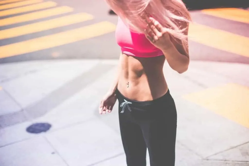Woman with toned stomach after LA-EMS Body Sculpting Treatment Old Trafford