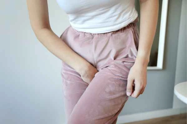 woman running for the toilet because of urinary incontinence Old Trafford
